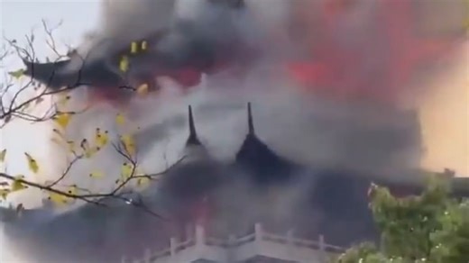 Tragic moment huge blaze engulfs temple as 'irresponsible' tourist is blamed