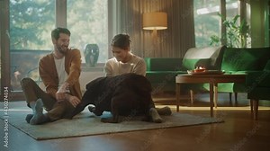 At Home: Happy Couple Play with Their Dog, Gorgeous Brown Labrador Retriever. Boyfriend and Girlfriend Tease, Pet and Scratch Super Happy Doggy, Have Fun in the Living Room