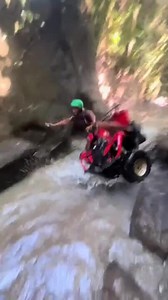 This girl was having a blast riding her ATV on this track on water when she hit a huge rock, causing her to fall off. Despite the fall, she got right back up and enjoyed the rest of the ride. | Jukin Copyright Management