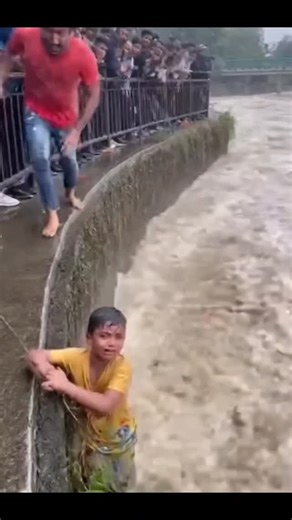 Brave man is saving the child. #rescue #brave #rescued #flood | Stupid Kitty