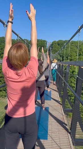 A yoga class like never before. Yoga In The Sky, coming soon to #SkyBridgeMichigan. 🧘🌤️ | Boyne Mountain Resort