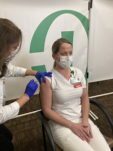 Column: Rush Copley front-line employees in Aurora roll up their sleeves for COVID-19 vaccine