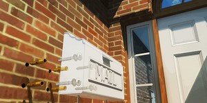 How to Mount a Mailbox to the Side of Your Home