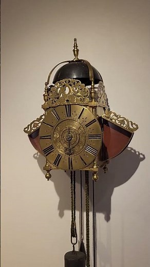 An early English engraved brass striking lantern clock with wings buckingham London, circa 1690