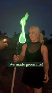 Holy Smokes! We turned fire green! 💚 Do you love the green flame? Thanks to the mad fire scientist @the_father_of_fire for letting me fire spin with green fire! What color should we try next? 🔥 #dragonstaff #fireperformer #greenfire | Grace Good
