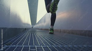 Woman running in a city. Slow motion shot.