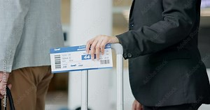 Ticket, queue and people at an airport for travel, holiday or vacation while waiting in line. Closeup of passenger group with luggage, suitcase or baggage for a flight or accommodation at a hotel