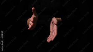 Hands applauding isolated on a black background, clapping hands over a black background