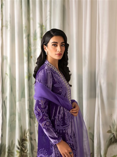Rabia Zahur on Instagram: "Velvetino by Rabia Zahur | Shop Now ✨ Crafted in pure lilac velvet, Stella features intricate cutwork embroidery and a hand-embellished neckline for a timeless statement. The look is completed with sharara pants and an organza dupatta detailed with dori and appliqué on the pallu. [Rabia Zahur, Velvetino, Luxury Velvet Wear, Embellished Velvet, Party Wear, Formal Wear, Winter Festive Collection]"