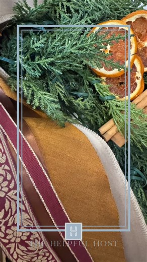 Decorating this @thehelpfulhost tree and entry for my clients was about creating a calm, collected holiday moment that blended with their newly designed dining room they love. The room has soft greens, warm wood, and hand painted details, so the tree echoed that palette with citrus, ribbon, and candlelight. It was designed to feel settled in the space, not competing with it. Some of my favorite touches are: 🍊 Citrus and warm tones that reflect the mural 🎀 Ribbon that picks up the natural color