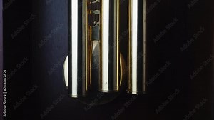 pendulum swinging back and forth, in a grand father clock, pendulum motion