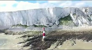 A rare spring tide has exposed the sea bed around the Beachy Head Lighthouse. Hundreds of people took advantage of the low tide today and joined a charity walk around the structure to raise money for the lighthouse upkeep and repainting. | BBC Kent