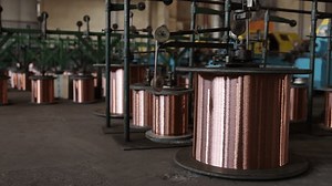 Copper production, Bare copper, Production facility. Numerous oversized copper coils are located within copper wire production facility.