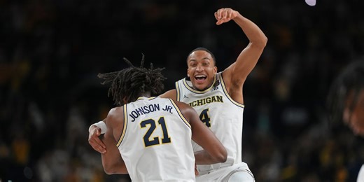 Michigan muscles its way to program’s 2nd national title, beating stubborn UConn 69-63