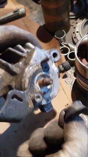 Simple fix for weirdly stuck handbrake on brake caliper