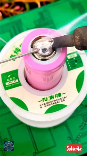 Service Ghor on Instagram: "The video displays the process of soldering a battery terminal, likely an 18650 lithium-ion cell, using a soldering iron and a spool of solder wire. Activity: A hot soldering iron tip is melting solder wire onto the top (positive) terminal of a pink cylindrical battery. This technique is often used for assembling battery packs or repairing electronics where components are connected via soldering rather than spot welding. Materials: Battery: A cylindrical rechargeable 