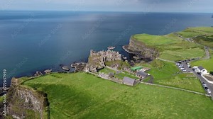 Dunluce Castle is one of the most picturesque and romantic of Irish Castles. With evidence of settlement from the first millennium, date mainly from the 16th and 17th centuries. Aerial Shot. Part 1.