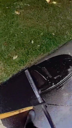 Coating road surface with new asphalt for smooth pavement