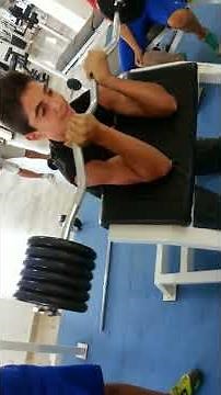 A boy of 12 years old is holding 70 kilos BICEPS