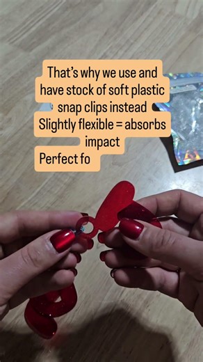 Both acrylic and metal are rigid, so there’s no shock absorption. Plastic Snap Clips can help!