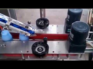 Automatic roller wheel capping machine for PET bottles with automated cap feeding elevator