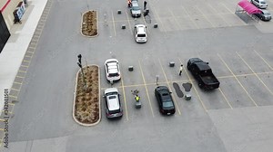 Aerial Curbside Delivery Pickup With Socially Distanced Vehicles At Storefront While Employees Deliver Packages