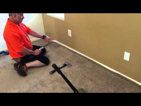 Trimming carpet with a carpet knife