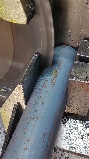 Cutting an iron bar using a sharp precision cutting machine