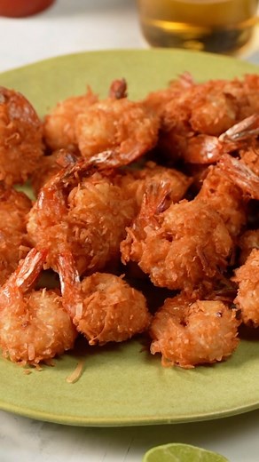 This is The Only Crispy Coconut Shrimp Recipe You Need We wanted to try our hand at a copycat of Red Lobster’s classic coconut shrimp, and this is the delicious creation. It’s so crispy, juicy, and light and makes a great snack or appetizer. Coconut Shrimp Ingredients ¾ cup all-purpose flour, divided ⅔ cup beer 1 large egg 1 ½ teaspoons baking powder 2 cups flaked coconut 24 medium raw shrimp, shelled, deveined, with tails attached 3 cups oil for frying Line a baking sheet with wax paper; set as