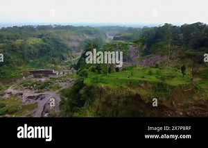 4k aerial footage of the Mount Merapi area, consisting of ravines that become lava flows, dense forests, and hills that occurred naturally when the volcano erupted some time ago Stock Video Footage - Alamy