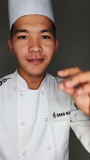 Cooking Techniques Demonstrated by Chef in QARA BAI Uniform