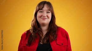 Secret smiling young woman 20s years old look aside close her mouth lock and throw away key isolated on solid yellow background studio portrait