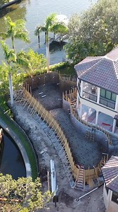 From Start to Finish, We Design and Build Insane Pools! The challenge of this unique project was to elevate the new pool to make it more usable for the entire family. It is a disguised lap pool with a freeform shape that follows the minimum setbacks from the water, creatively making the pool as big as possible. It's backed with a blend of modern features and a timeless rock wall. #insanepools #lucaslagoons #pool #backyard | Lucas Lagoons