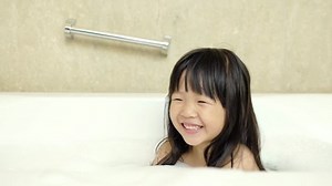 clip-26147267-video-cute-girl-take-bath-smile-happily