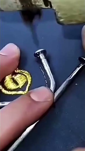 the stage of sewing a nail onto the fabric to make it easier to form it using a sewing machine