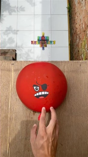 Experiment: Dropping red and yellow emoji water balloons from a height