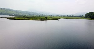Aerial 4K Drone footage of Lake Bala, North Wales. Video starts at a single tree on a island on Lake