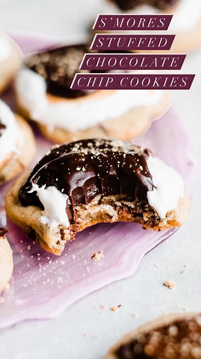 Stephanie Simmons on Instagram: "I'm officially declaring that our summer baking starts NOW and we're kicking it off with these S'mores Stuffed Chocolate Chip Cookies. 🎉🏕 They're made with a perfectly soft chocolate chip cookie stuffed with more chocolate, topped with toasted marshmallow cream, and finished off with chocolate ganache. Sheer summer perfection! Recipe linked in my profile @bluebowlrecipes or find it here -- https://bluebowlrecipes.com/chocolate-stuffed-smores-chocolate-chip-cook