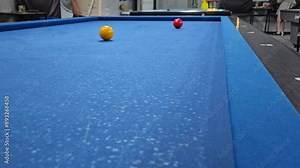 People playing carom 3 cushion billiard games, known as French billiards, it consists of three balls and a table without holes.