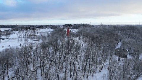 clip-4002576293-drone-view-viimsi-lighthouse-rising-above-snowy