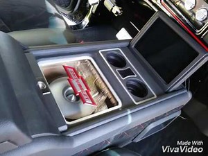 Chevy truck custom subwoofer center console with sliding compartments.