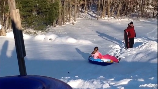 10 y/o girl knocks down dad who was in her way during her sledding adventure