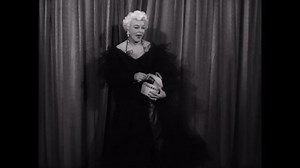 CIRCA 1950 - A burlesque singer performs at Follies Theater in Los Angeles, California.