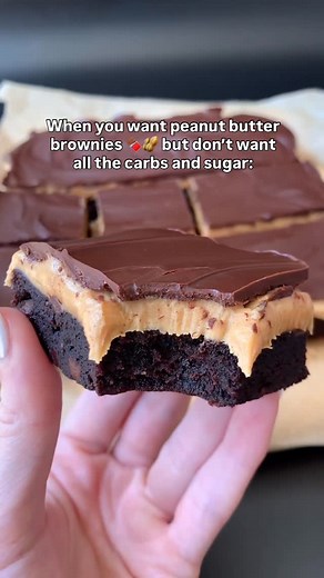 Sarah Kadison on Instagram: "KETO PEANUT BUTTER BROWNIES 🍫🥜 Layers of low carb fudge brownies, creamy peanut butter filling, and chocolate ganache. Gluten-free and only 3 net carbs each! Comment PB BROWNIES below and I’ll send you the full recipe! 🎉 Or google “baketobefit peanut butter brownies” or find the full recipe on my site baketobefit.com ❤️ #ketobrownies #peanutbutterbrownies #lowcarbrecipes"