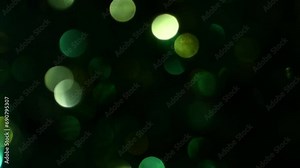 Fast moving shiny sparkly dark green olive black white circles out of focus background constantly moving side-to-side Stock Video