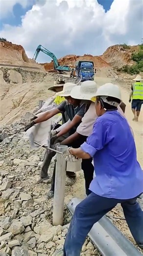 Installing Highway Guardrails Manually Takes Strength and Time - Good tools make work easy