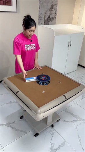 automatic electric mahjong table with a built-in shuffling mechanism and magnetic tiles.