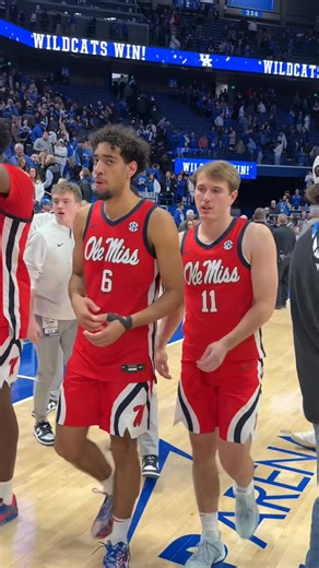 Kentucky players greet former teammate Travis Perry after the game, sharing handshakes and celebration. | Mario A Maitland