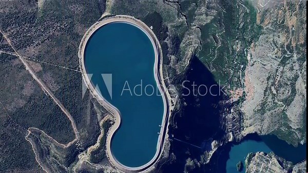 The Cortes La Muela Pumped Stroge Hydropower Plant is the largest Pumped storage power plant of Europe in Spain and Cortes II Dam aerial drone view.