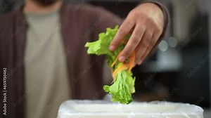 Ecology compost supply Kitchen waste sorting waste vegetable peels to recycle composter environmentally friendly. Man throws leftover fruit peel and vegetables reduce zero waste.